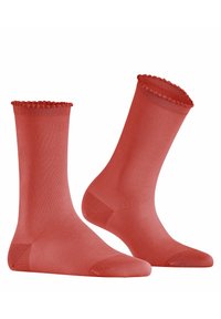 Chaussettes rouges avec un revers festonné, présentant un motif texturé de pois, fabriquées à partir d'un matériau lisse et extensible.