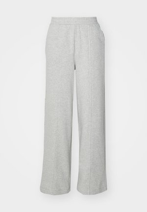 Grå joggebukser laget av mykt stoff, med bred bendesign, elastisk midje og sidelommer. Enkel og uformell stil.
