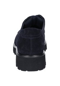Navy suede shoes with a flat, textured black sole; features subtle stitching details along the back and rounded heel.