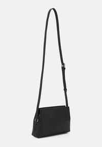Calvin Klein CROSSBODY - Taška s příčným popruhem - black