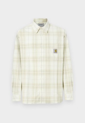 Helle Karobluse mit langen Ärmeln, Knopfleiste und einer Brusttasche mit einem Logopatch. Aus Baumwolle mit einer weichen Textur.