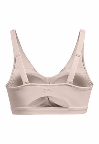 Sostén deportivo color beige claro con una tela suave y elástica. Cuenta con tirantes ajustables, una banda ancha y un diseño de espalda abierta con recortes.