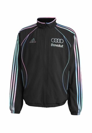 Veste de survêtement noire Adidas avec des rayures bleu pastel et rose sur les manches, fermeture éclair devant, et logos Revolut et Audi sur la poitrine.