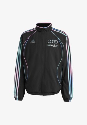 Veste de survêtement noire Adidas avec des rayures bleu pastel et rose sur les manches, fermeture éclair devant, et logos Revolut et Audi sur la poitrine.