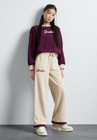 Jordan META ENCHANTMENT COZY  - Treniņtērpa apakšdaļas - legend light brown