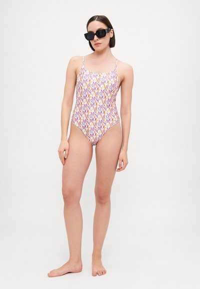 One-piece swimsuit with a colorful logo pattern on a white background. Features thin straps and a fitted design. Smooth fabric texture.