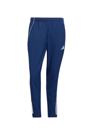 Donkerblauwe sportbroek gemaakt van lichtgewicht materiaal, met een taps toelopende pasvorm, elastische tailleband en witte zijaccenten.