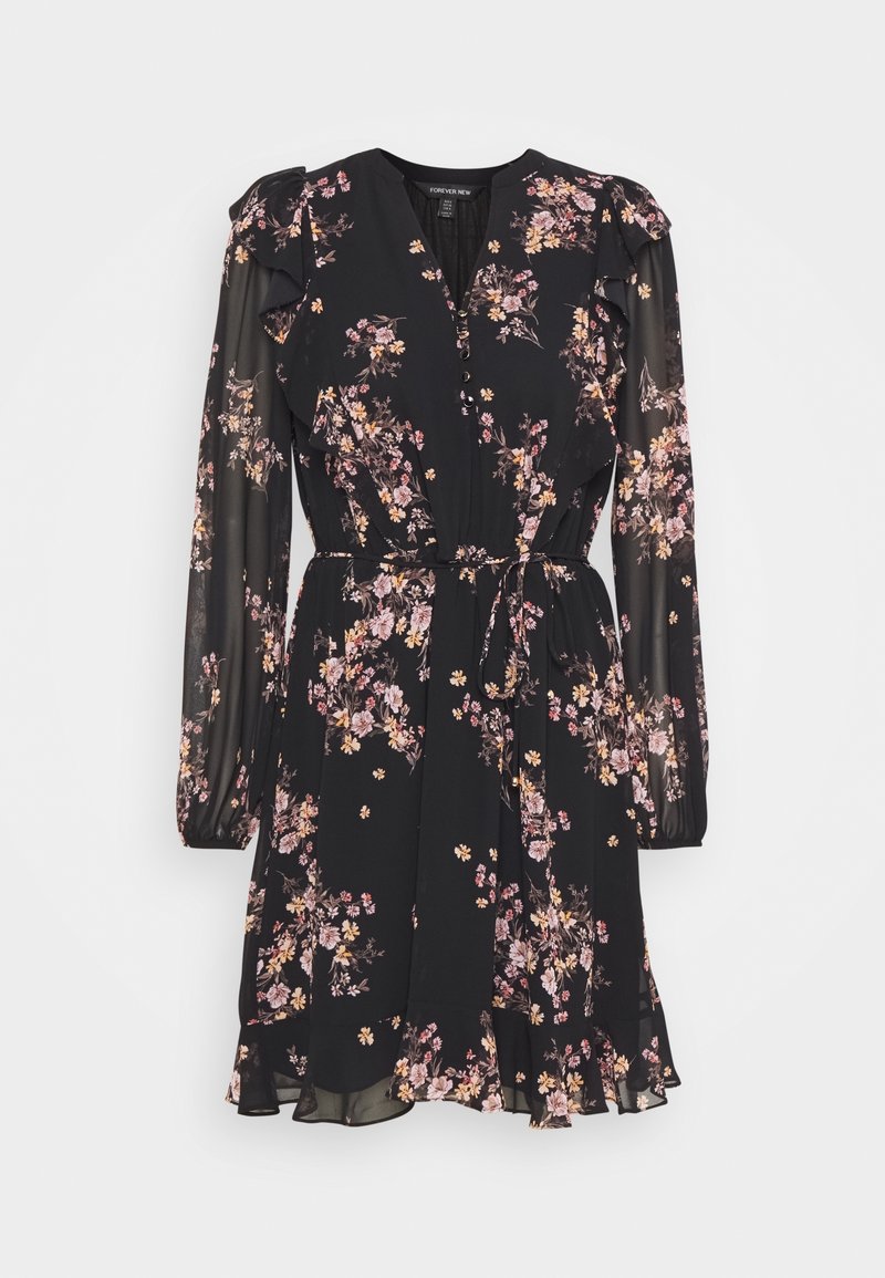 Robe noire à fleurs longueur genou avec manches longues transparentes, épaules à volants, encolure en V boutonnée et ceinture nouée à la taille.