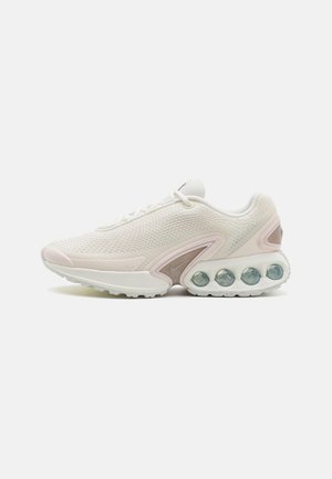 Lightweight sneakers featuring a breathable mesh upper in white with pale pink accents, rounded toe, and distinctive air bubble sole.