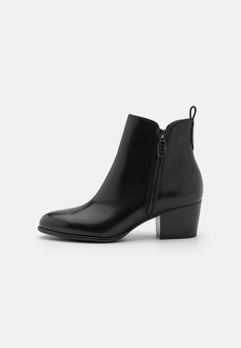 Black leather ankle boot with a side zipper, pointed toe, and a block heel. Smooth texture with minimalistic design and a pull tab.