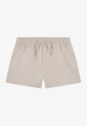 Bež sportske kratke hlače s elastičnim pojasom i vezicom, s malim bijelim Jumpman logom na lijevoj nozi.