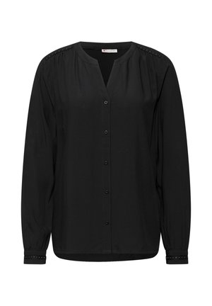 Zwarte blouse met lange mouwen, V-hals, knopen aan de voorkant en decoratieve studs op de schouders en manchet, gemaakt van een lichte, gladde stof.