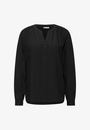 Blouse noire à manches longues avec un décolleté en V, des boutons sur le devant et des clous décoratifs sur les épaules et les poignets, fabriquée à partir d'un tissu léger et lisse.