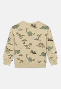 Μπεζ φούτερ με διάφορους καρτουνίστικους δεινόσαυρους σε πράσινο, καφέ και ανοιχτό γαλάζιο, με ριμπ λαιμόκοψη και μανσέτες.