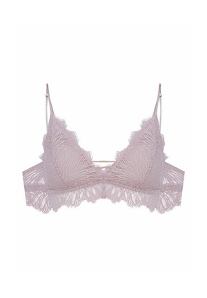 Lace bralette in light pink with floral pattern, scalloped edges, thin adjustable straps, and a decorative gold accent in the center.