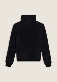 Pullover in pile nero con colletto alto, tessuto testurizzato, polsini e orlo a coste. Design di lunghezza media con una vestibilità ampia.