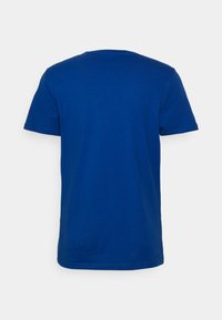Short-sleeve, round-neck t-shirt in solid royal blue. Made from soft cotton, featuring a smooth texture with no visible graphics or patterns.