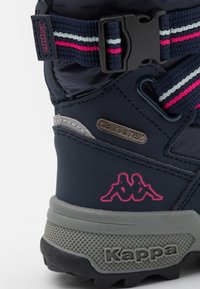 Blue waterproof boot with grey sole. Features a patterned strap in blue, pink, and white, and a pink Kappa logo. Textured rubber outsole.