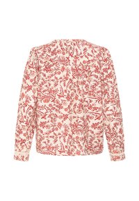 Blouse à manches longues avec des motifs floraux rouges sur fond blanc, présentant une coupe ample et des poignets boutonnés, vue de dos.