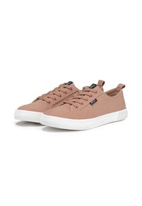 Pair of light brown canvas low-top sneakers with white rubber soles and black logo tags on laces and sides.