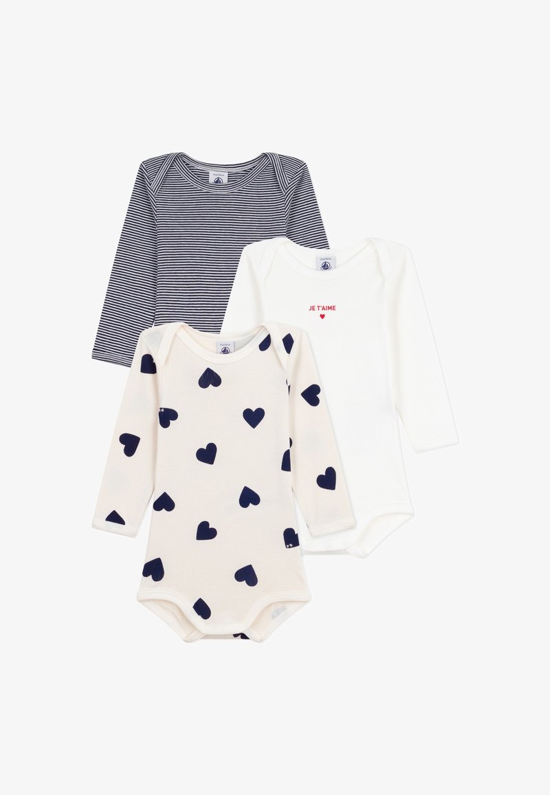 Trois bodies à manches longues : un à rayures navy, un blanc avec "JE T'AIME" en rouge, et un crème avec des motifs de coeurs navy. Matière en coton douce.