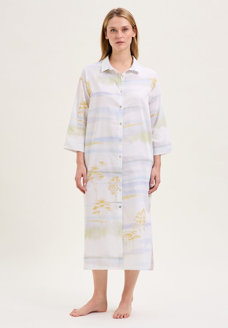 Abito camicia in tessuto leggero, caratterizzato da un motivo floreale ad acquerello in morbidi pastelli di verde, giallo e blu. Maniche lunghe, lunghezza fino al ginocchio.