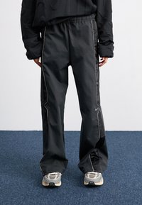 Nike Sportswear Treniņtērpa apakšdaļas - black