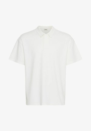 Wit poloshirt gemaakt van katoen, met korte mouwen, een kraag en een losse pasvorm. Geen zichtbare patronen of hardwaredetails.