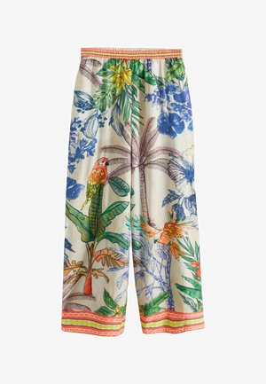 Weite Hosen mit elastischem Bund, versehen mit einem bunten tropischen Muster aus Papageien, Palmen, großen Blumen und grünem Laub.
