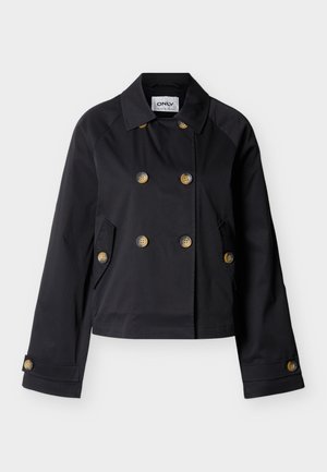 Veste noire courte à double boutonnage avec large col, six boutons marron, poches à rabat latérales et poignets de manches boutonnés.