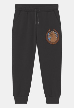 Schwarze Jogginghose mit elastischem Bund und Kordelzug. Verziert mit einem gestickten Pferdemotiv in einem runden braun-blauen Aufnäher.