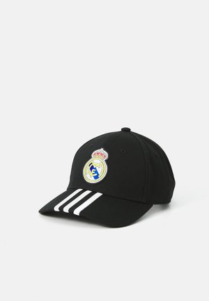 Zwarte honkbalpet met witte strepen op de klep, voorzien van een ronde, geborduurde Real Madrid-logo aan de voorkant. Gemaakt van katoen.