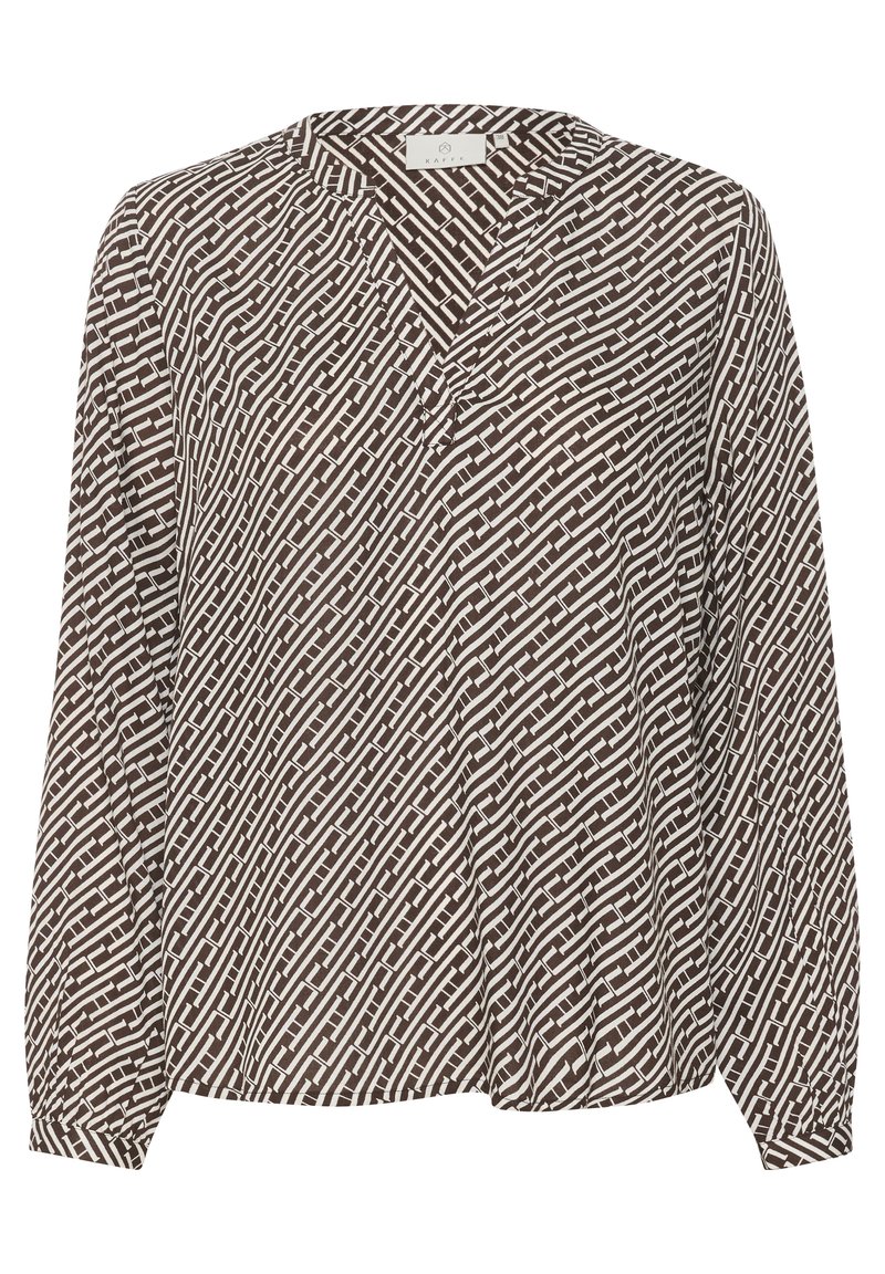 Brūna un balta rakstaina blūze ar V-veida kaklu, garajām piedurknēm un brīvu piegriezumu. Satur faktūras ģeometrisko dizainu visā audumā.