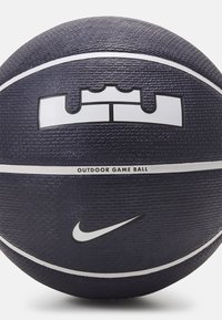 Basketball featuring a textured dark purple surface, white accent stripes, a LeBron logo, and a Nike swoosh. Designed for outdoor play.