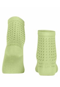 Lichtgroene enkel sokken met een gestructureerd breipatroon, voorzien van openwerk patronen en een geribbelde boord voor extra comfort en pasvorm.