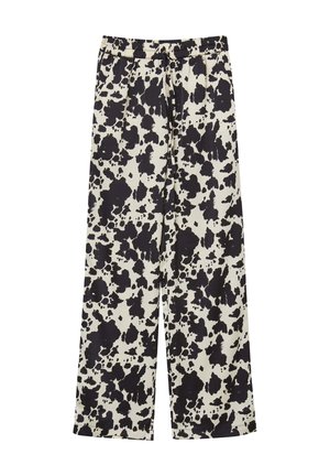 Pantaloni larghi neri e crema con motivo a schizzo, cintura elastica e texture morbida.