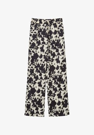 Schwarz-creamfarbene weite Hose mit einem Spritzmuster, elastischem Bund und weichem Stoffgefühl.