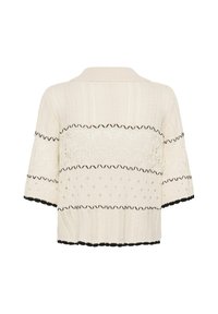 Pull en maille crème à manches courtes avec motifs en zigzag et points noirs, bords noirs festonnés aux manches et à l'ourlet, et col côtelé.