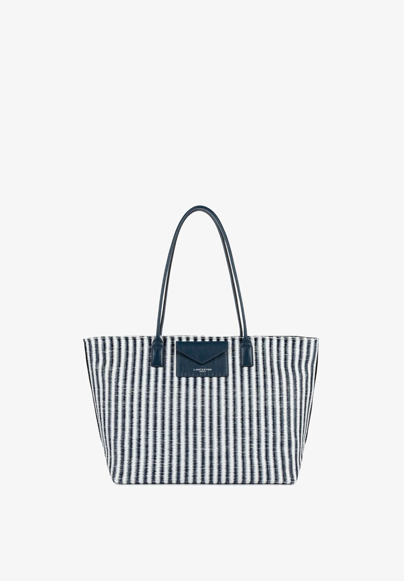 Sac fourre-tout tissé en noir et blanc avec deux longues poignées noires et une petite poche avant avec le logo "Lancaster Paris".