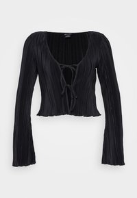 Haut noir court à texture côtelée, col en V profond, fermeture à nouer à l'avant, et manches longues évasées.