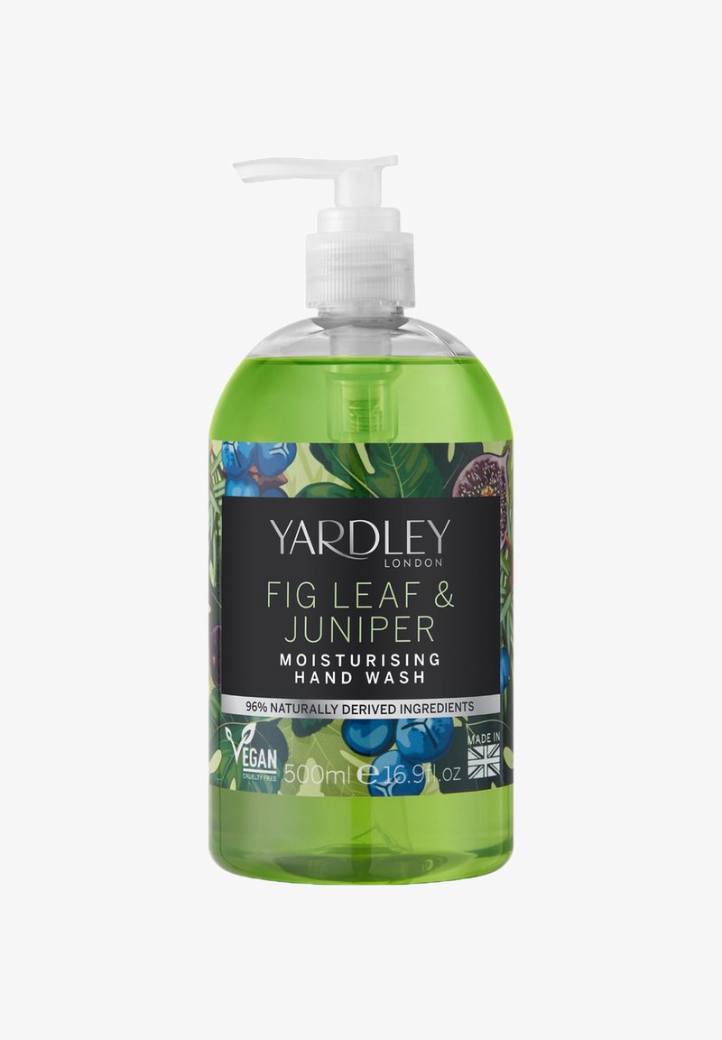 Grüne Flüssigseife in einer klaren 500 ml Pumpflasche. Mit floralem Design, schwarzem Etikett und den Hinweisen "vegan" und "made in UK."