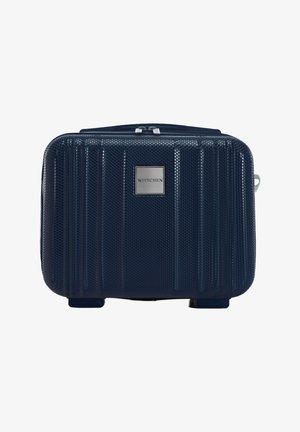 Marineblauwe harde koffers met een textuur, verticale ribbels, metalen logo-plaat en een rits aan de bovenkant. Compact rechthoekige vorm met vier voeten.