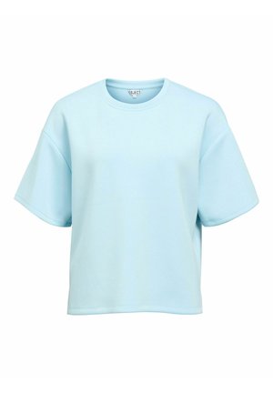 T-shirt bleu clair surdimensionné en tissu doux, avec manches courtes et col rond, sans motifs ni accents visibles.