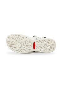 Suela de zapato blanca con un diseño texturizado; presenta un acento central en rojo. La superficie incluye patrones ovalados variados para mejorar la tracción.