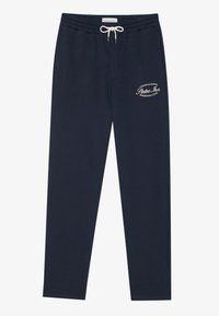 Navy joggingsbroek gemaakt van zachte stof, voorzien van een elastische tailleband met een trekkoord en een wit bedrukte logo op de linker bovenbeen.
