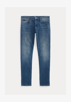 Modré džíny z denimu s úzkym strihom, prezentujúce vyblednutý efekt, päť vreciek a zips s horným gombíkom. Výrazné švy.