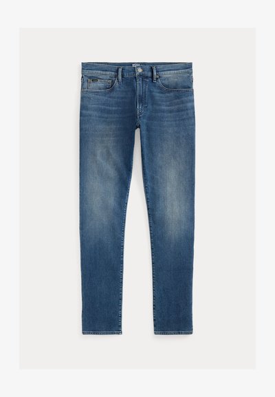 Mėlynos džinsinės kelnės su siauru siluetu, turinčios nudilimo efektą, penkias kišenes ir užtrauktuką su viršutiniu mygtuku. Išskirtinės siuvimo detalės.