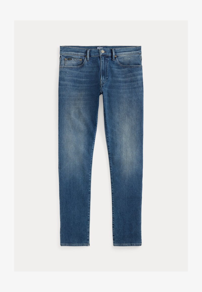 Jeans in denim blu con una vestibilità slim, caratterizzati da un effetto sbiadito, cinque tasche e una zip con bottone superiore. Dettagli di cucitura prominenti.