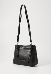 Black leather handbag with a single long strap, front zip pocket, rounded handles, and white stitching accents. Smooth texture, structured shape.