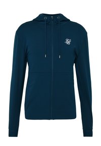 Veste à capuche zippée bleu marine avec cordon de serrage, manches longues, poches avant et petit logo brodé blanc sur la poitrine.